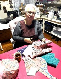 Former Government of Nunavut minister Manitok Thompson puts her skills on display with new fabric designs unveiled in December 2025. Photo courtesy Tom Thompson